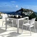 A white Siesta Capri wickerlook chair and table on a balcony.