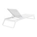 A Siesta Tropic white resin chaise lounge with white sling on a white background.