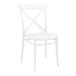 A Siesta Cross white resin outdoor dining chair with a cross back and seat.