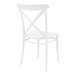 A Siesta white resin outdoor dining chair with a cross back and seat.