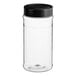 A clear plastic spice container with a black lid.