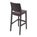 A Siesta Jamaica brown wicker outdoor barstool with a backrest.