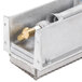 A metal box with a metal piece inside.