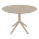 A Siesta Sky round taupe table on a white base.