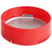 A red plastic round spice container with a red induction-lined dual flapper lid with 13 holes.