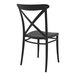 A Siesta Cross black resin outdoor dining chair with a backrest.