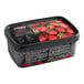 A container of Andros Chef Sweetened Strawberry Puree with a black lid on a table with a picture of strawberries.