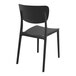 A Siesta Monna black resin outdoor dining chair with a backrest.
