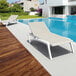 A white Siesta Pacific chaise lounge next to a pool.