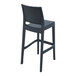 A dark gray Siesta Jamaica wickerlook barstool with a back.