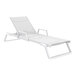 A Siesta Tropic white resin outdoor arm chaise lounge with white sling on a white background.