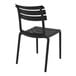 A black plastic Siesta Helen outdoor dining chair.