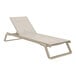 A taupe Siesta Tropic chaise lounge with a taupe sling on a white background.