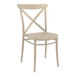 A taupe resin Siesta Cross outdoor dining chair with a cross back.