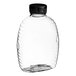 A clear plastic Queenline honey bottle with a black flip top lid.
