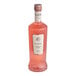 A close up of a Fluere Non-Alcoholic Raspberry Blend Pink Gin bottle full of pink liquid.