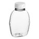 A clear Queenline PET honey bottle with a white plastic flip top lid.