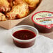 An open container of Ken's Foods Cannonball BBQ Sauce.