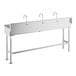 A stainless steel Regency hand sink with three wall mount faucets.