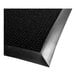 A black Berber carpet mat with a rubber border.