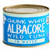 A Sea Tales Albacore Tuna can with a blue label on a white background. The can contains chunk white albacore wild tuna in water.