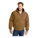 A man wearing a brown CornerStone hooded work jacket.