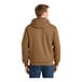 A man wearing a CornerStone brown hooded sweatshirt.