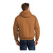 A CornerStone unisex duck cloth work jacket in brown with a hood.