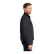 A CornerStone unisex charcoal work jacket with black corduroy collar and zipper.