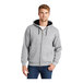 A man wearing a CornerStone athletic heather grey zip-up hooded sweatshirt with black trim.