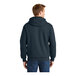 A man wearing a CornerStone navy hoodie with a thermal lining.
