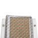 A metal mesh burner set with holes.