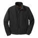 A black CornerStone work jacket with a black and orange zipper.