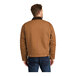 A man wearing a CornerStone brown work jacket with black corduroy collar.