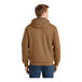 A man wearing a CornerStone brown thermal-lined sweatshirt with a hood.