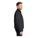 A CornerStone charcoal work jacket for men with black corduroy collar, zipper, and two pockets.