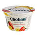 A close up of a white Chobani Greek yogurt container with a label that reads "Low-Fat Strawberry Banana"