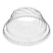 A clear plastic low dome lid with a hole over a clear plastic cup.