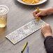 A child coloring a farm picture with a yellow crayon.