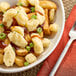 A white bowl filled with Ellsworth Cooperative Creamery Ranch Cheddar Cheese Curds.