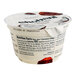 A white Chobani Low-Fat Coconut Greek Yogurt container with a label on it.