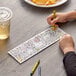 A child coloring a farm picture with a yellow crayon.