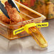 A yellow Vigor high-heat food pan label with "chicken" written on it.