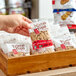 A hand holding a package of Homefree vegan gluten-free chocolate chip cookies.