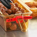 A close up of a Vigor red blank food label on a container of meatballs.