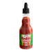 A Frank's RedHot Sriracha chili sauce bottle on a white background.