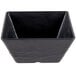 An American Metalcraft black square melamine bowl with a white border.