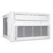 A white Friedrich Chill Premier window air conditioner with buttons and a vent.