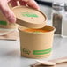 A 12 oz. kraft paper food cup with a vented compostable lid from EcoChoice.