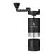 A black and silver VSSL Java G25 hand coffee grinder.